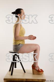 Sitting reference of whole body yellow t shirt gray shorts…